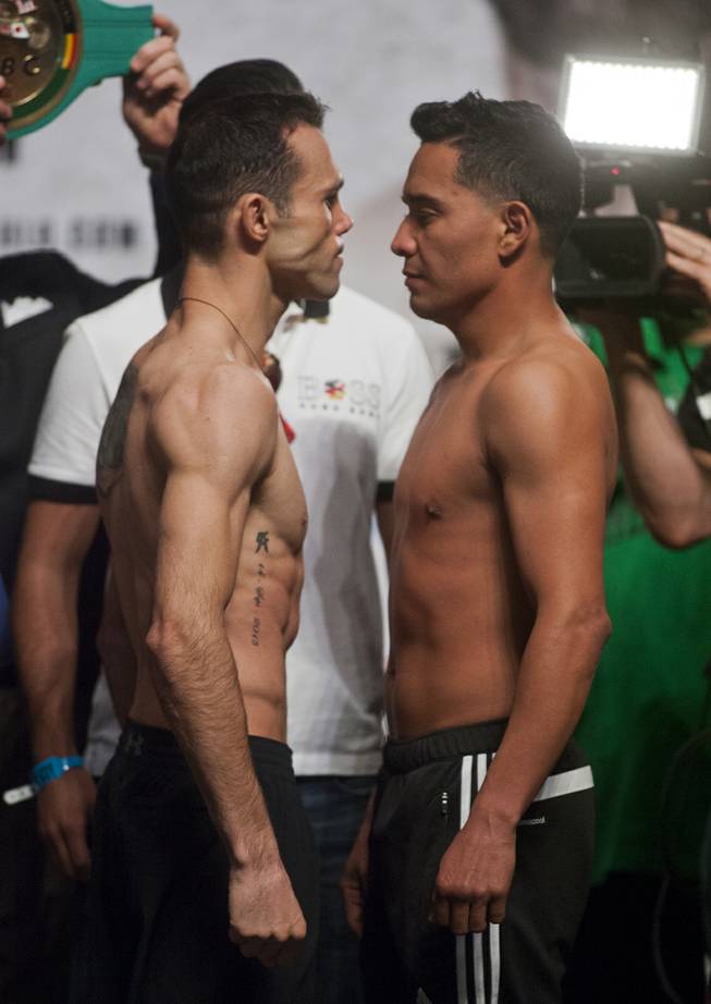 Lightweights Ricardo Alvarez and Sergio Thompson, both of Mexico, face off for fans following their weigh-ins at the MGM Grand Arena on Friday, March 07, 2014.